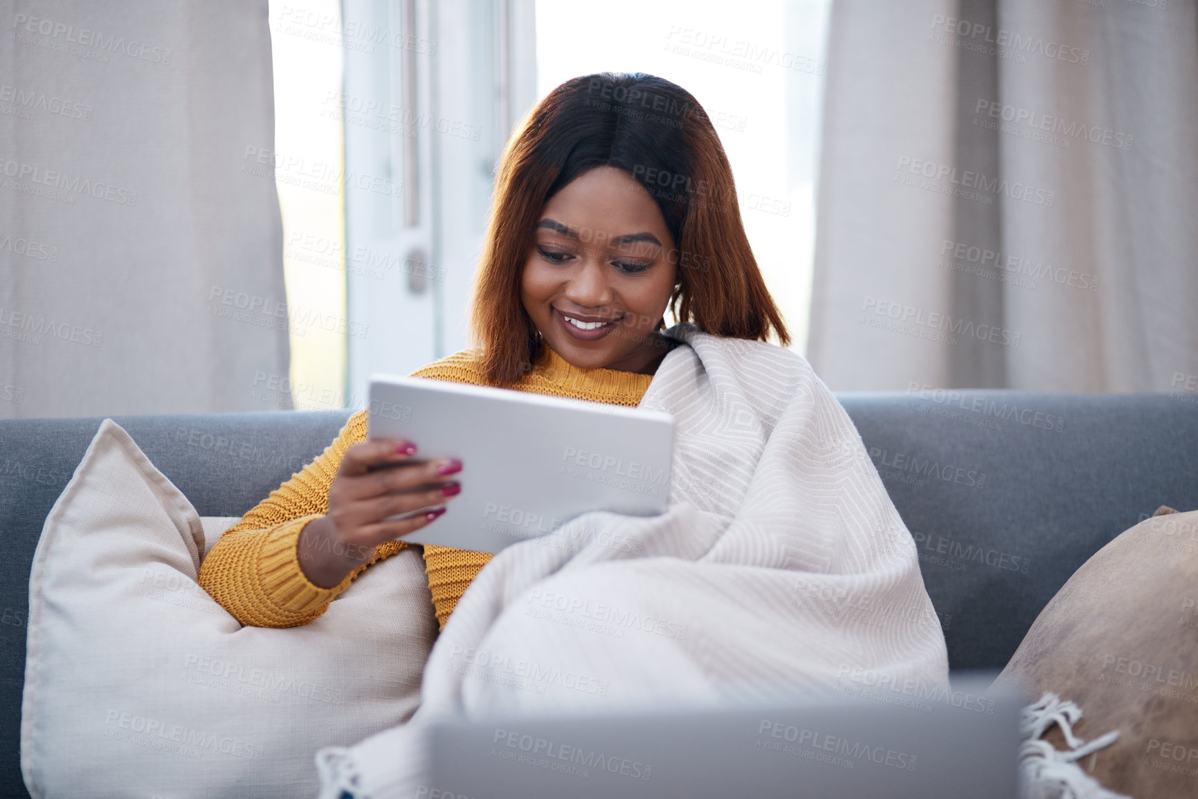 Buy stock photo Tablet, reading and happy black woman on sofa with social media, movie or website scroll at home. Digital, search or cosy girl with blanket in living room with sign up subscription for app streaming