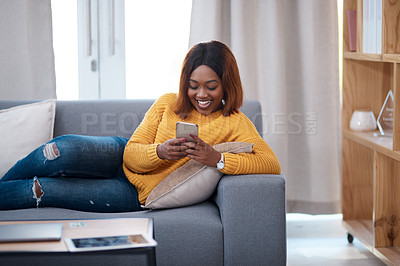 Buy stock photo Funny, phone and black woman laughing on sofa with silly chat, text or gif communication at home. Smartphone, joke and girl reading joke, meme or app streaming social media, comic or reel in house