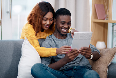 Buy stock photo Black couple, tablet and online with digital app in home for streaming entertainment, movie or internet. Man, woman and relax in apartment with network subscription for watching, bonding or website