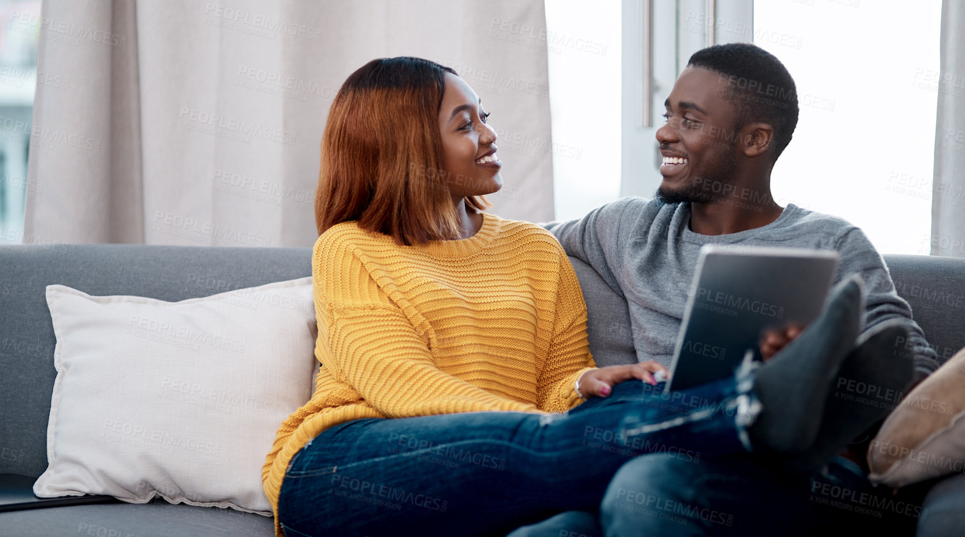 Buy stock photo Black couple, tablet and relax with digital app in home for streaming entertainment, movie or internet. Man, woman and sofa in apartment with network subscription for watching, bonding or website