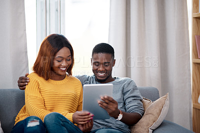 Buy stock photo Black couple, tablet and couch with digital app in home for streaming entertainment, movie or internet. Man, woman and relax in apartment with network subscription for watching, bonding or website