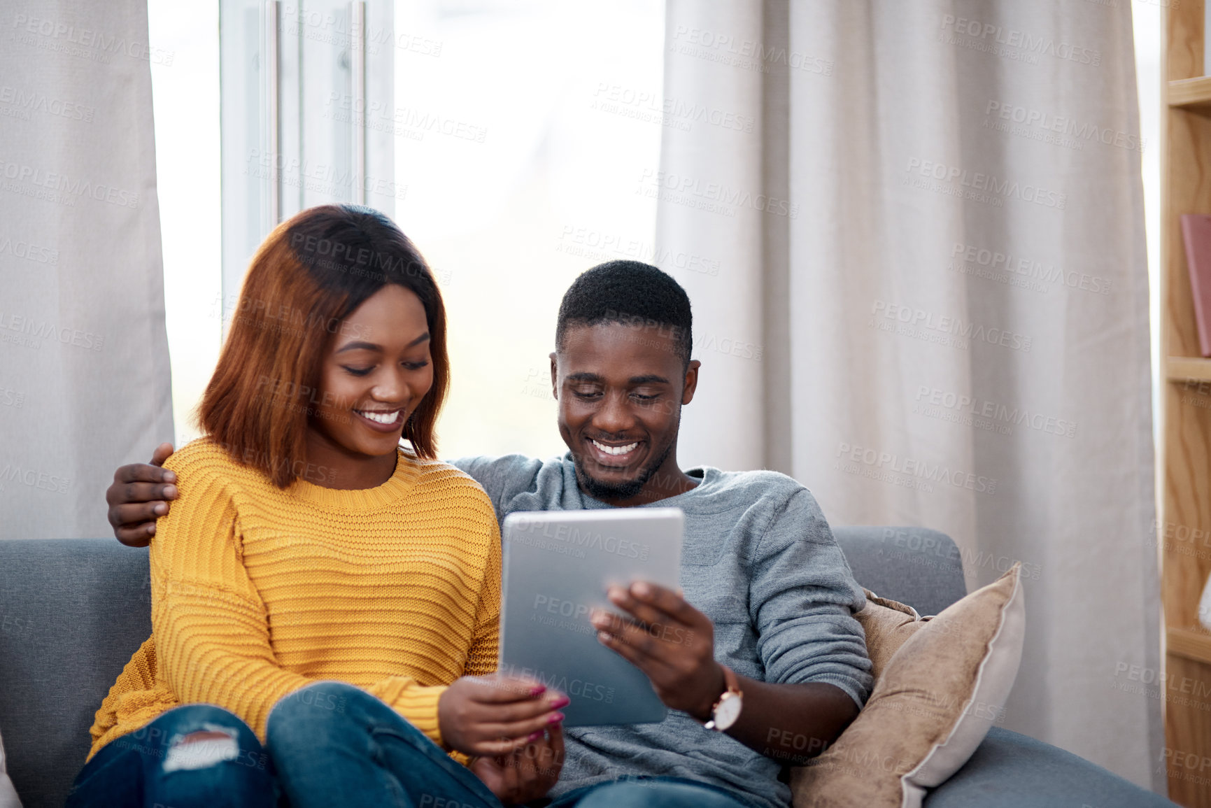 Buy stock photo Black couple, tablet and couch with digital app in home for streaming entertainment, movie or internet. Man, woman and relax in apartment with network subscription for watching, bonding or website