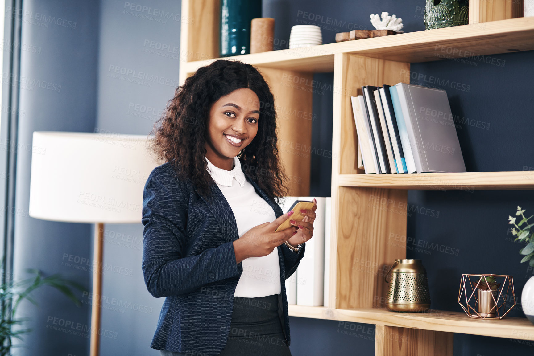 Buy stock photo Portrait, smile and business with black woman, smartphone and lawyer in modern office. Face, African person and employee with cellphone and attorney with online schedule and email with company info