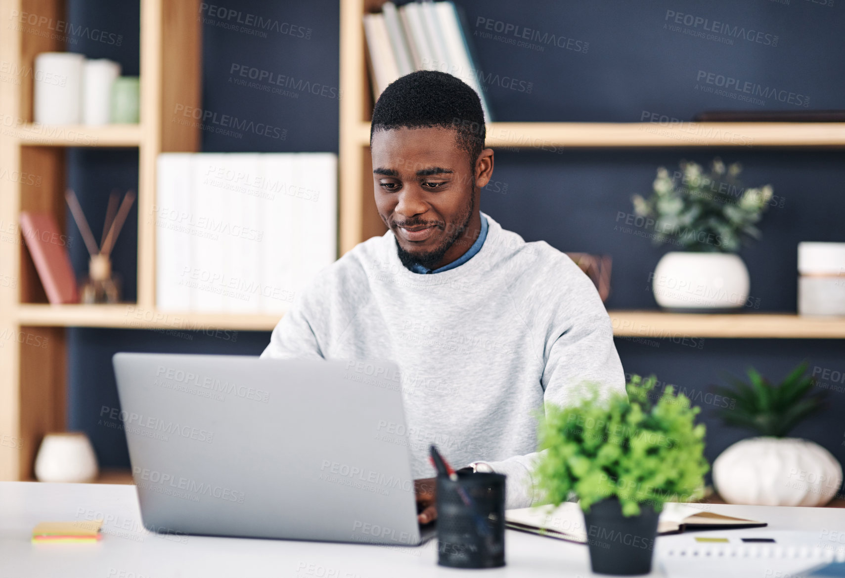 Buy stock photo Black man, smile and laptop in office for web design, digital project or social media communication. Business person, internet or working on tech typing for connectivity, online search or blog post
