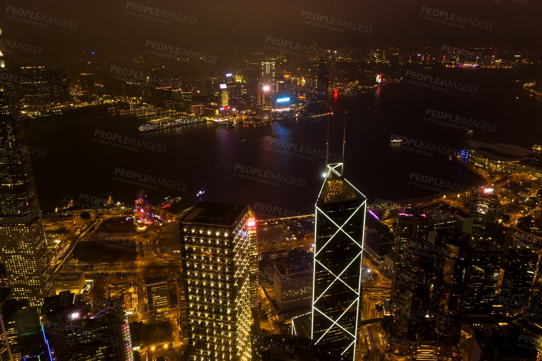 Buy stock photo Night, cityscape and urban skyline by buildings, light or architecture for infrastructure, development or expansion. Dark metro, cbd or city background by skyscraper, road or drone view of Hong Kong