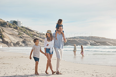 Buy stock photo Family, walking and carrying on beach for holiday, travel and bonding together in summer with sand or water. Woman, dad and kids by ocean for fun trip, vacation and relationship with holding hands