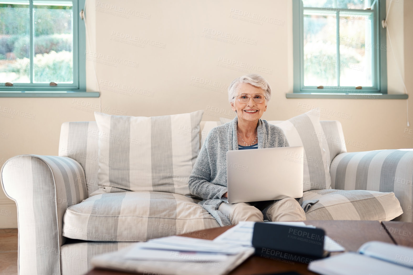 Buy stock photo Laptop, sofa and portrait of senior woman in living room to pay bills, investment or retirement fund. Happy, relax and elderly female person with computer for online banking app for pension in home.