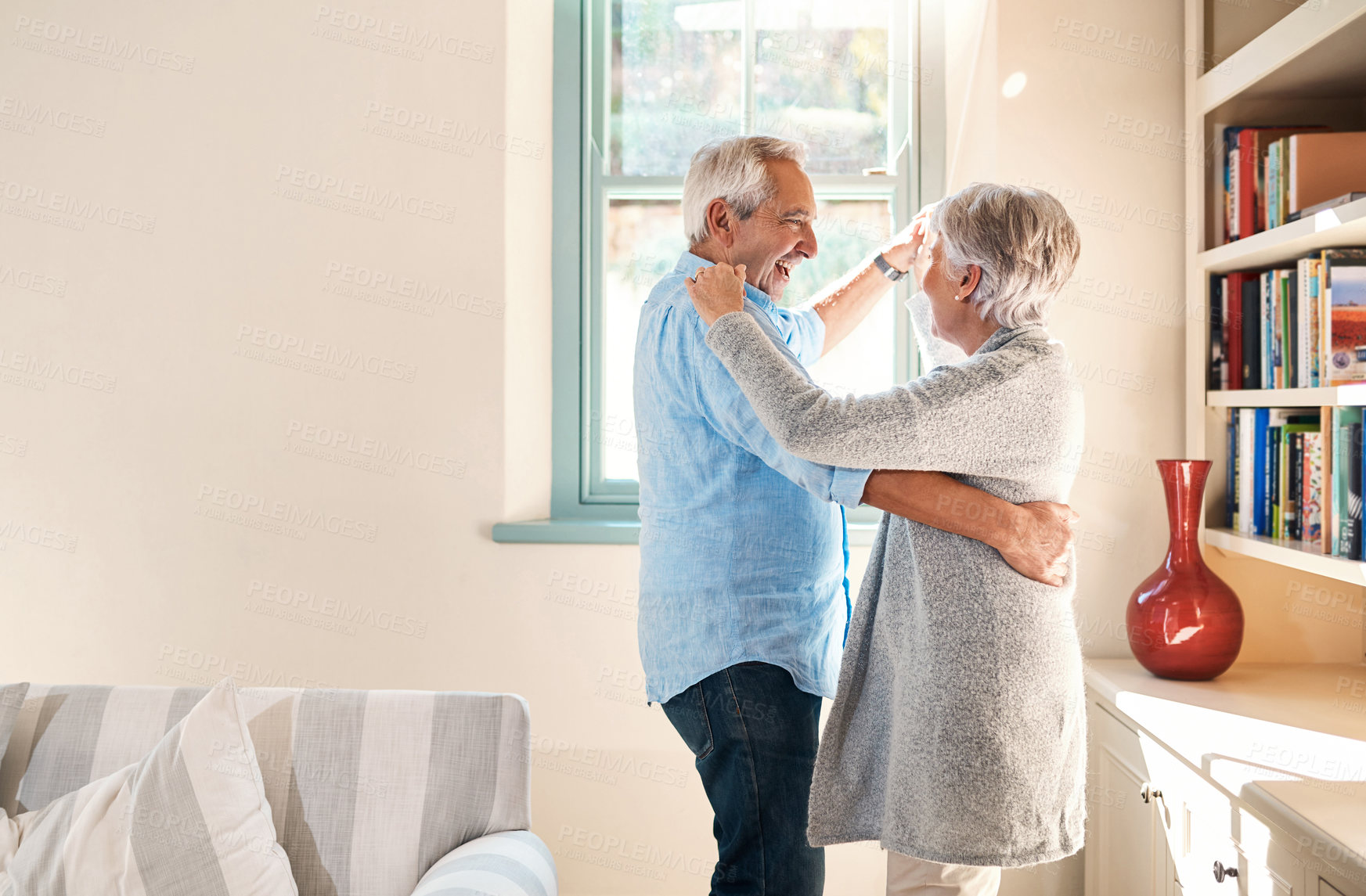 Buy stock photo Elderly couple, dancing and home living room with smile, happiness or love for care, support or laugh. Senior man, excited old woman or dance together in house with romance, comic bonding and space