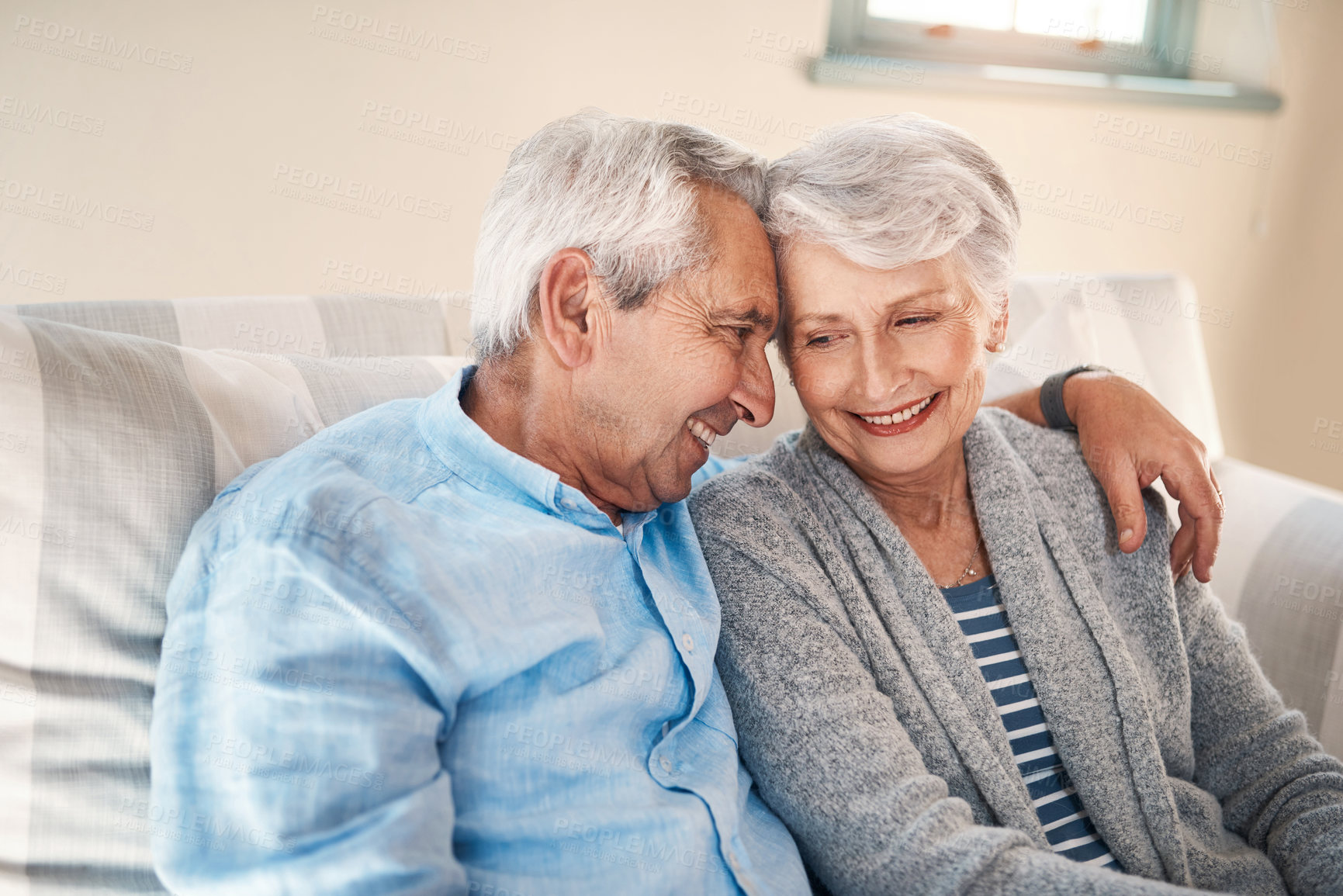 Buy stock photo Happy, love and senior couple on sofa for connection, bonding and relaxing together at home. Smile, hug and elderly man and woman in retirement embracing, marriage or resting in living room at house.