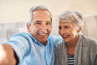 Buy stock photo Senior couple, happy selfie and couch in retirement home for social media, blog post and internet. Elderly man, woman and photography for profile picture on app, web or smile together on lounge sofa