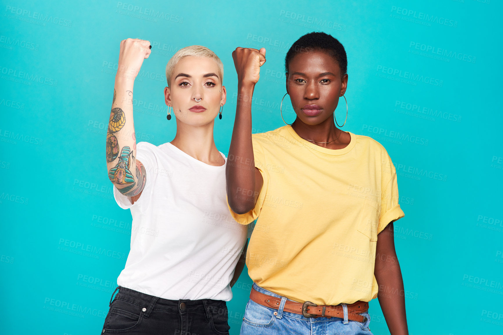 Buy stock photo Women, fight and portrait with fist for human rights, lgbt and revolution gesture for power. Diversity and pride of young people with blue background in studio with rally, equality and protest sign