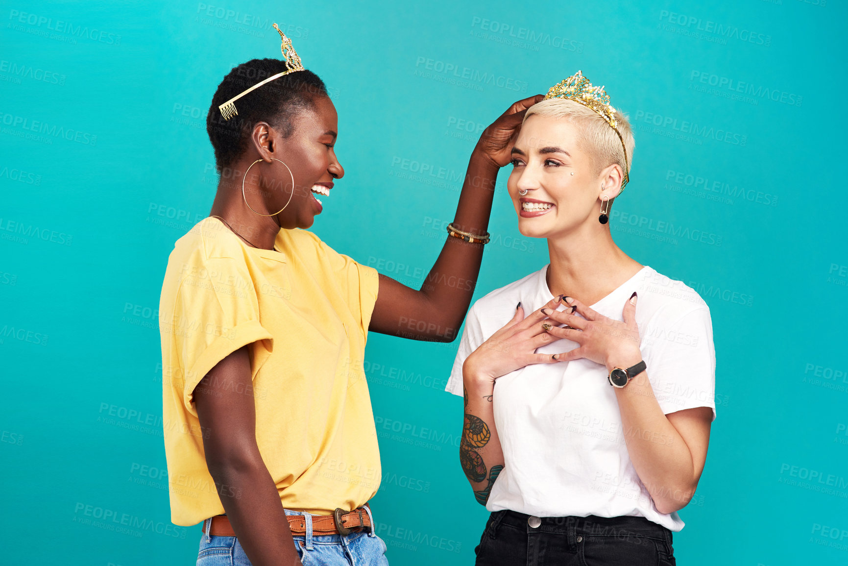 Buy stock photo Girls, happiness and winning with crown, confidence or aesthetic in studio background for diversity. Female people, pride and tiara as cheerful for empowerment, womens day or celebration as friends