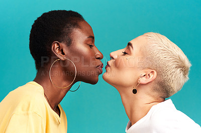 Buy stock photo Love, diversity and kiss, lesbian couple on studio background in happy lgbt relationship together. Lgbtq romance, pride and black woman kissing partner on backdrop, happiness with gen z women on date
