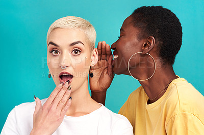 Buy stock photo Surprise secret, shock and girl friends portrait with privacy, laugh and gossip in a studio. Blue background, women and smile of a female person with whisper and news telling a story and listening