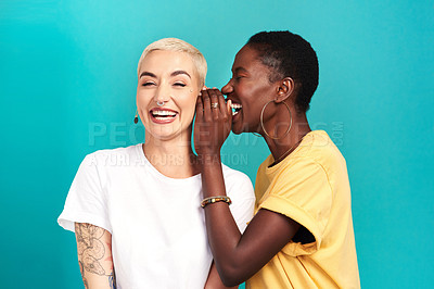 Buy stock photo Whisper, secret and girl friends portrait with privacy, laugh and gossip in a studio. Blue background, women and smile of a female person with diversity and funny news telling a story and listening