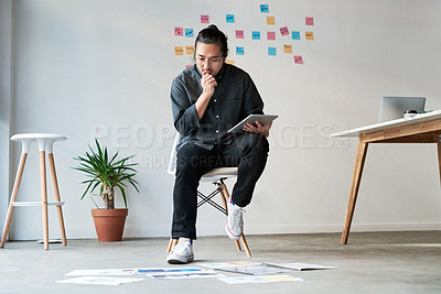 Buy stock photo Thinking, man and graphic designer research on tablet with documents for creative idea, planning or problem solving. Reading, tech and startup business for inspiration or decision with paper on floor