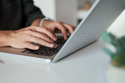 Buy stock photo Shot of an unrecognizable businessman working on his laptop at work