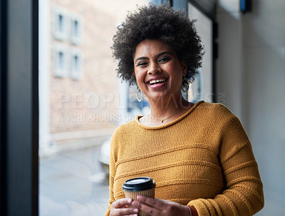 Buy stock photo Portrait of an attractive young businesswoman drinking coffee and looking cheerful in her office at work
