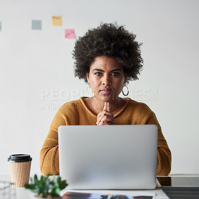 Buy stock photo Portrait of an attractive young businesswoman looking thoughtful and fully focused while working in her office