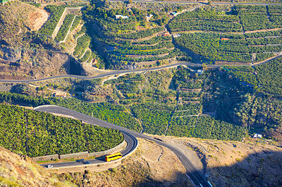 Buy stock photo Beautiful landscape of a small agricultural village on a sunny afternoon near a highway or busy road for logistics or transport of goods. Banana plantations in the town Los Llanos, La Palma, Spain