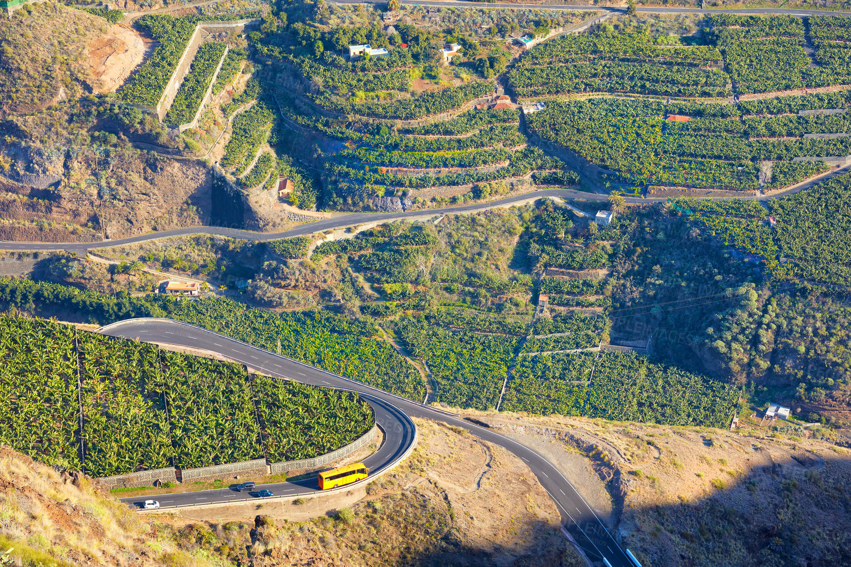 Buy stock photo Beautiful landscape of a small agricultural village on a sunny afternoon near a highway or busy road for logistics or transport of goods. Banana plantations in the town Los Llanos, La Palma, Spain