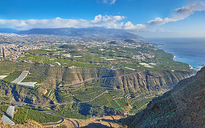 Buy stock photo Above landscape view of fruit plantations outside La Llanos city, La Palma, Spain. Tropical scenic hills, sea and ocean, farming and architecture town buildings. Travel abroad to tourism destination