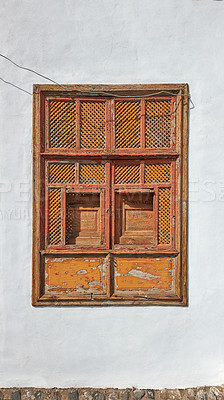 Buy stock photo Architecture of an old grey wall with a rusted metal window outside. Exterior texture details of an old rustic residential build with vintage wooden shut windows discovered in Santa Cruz de La Palma