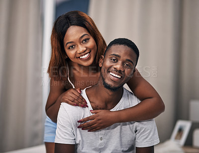 Buy stock photo Black couple, portrait and smile in home bedroom for relaxing together, bonding or comfortable. Man, woman and face with hugging embrace in apartment for happy relationship with care, peace or calm
