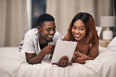 Buy stock photo Black couple, tablet and bed in home for relax entertainment or streaming movie for resting, bonding or subscription. Man, woman and online with digital app or comfortable day off, watching or film