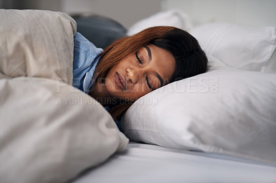 Buy stock photo Cropped shot of an attractive young woman sleeping peacefully in bed at home