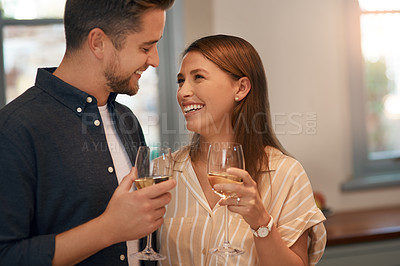 Buy stock photo Champagne, toast and happy couple in a house with love, trust or celebration for birthday, anniversary or good news. Wine, cheers or people in home party for real estate, success or investment growth