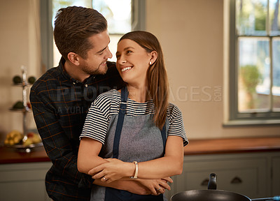 Buy stock photo Love, hug and couple in kitchen for cooking, brunch or bonding with care or security at home. Food, diet and nutrition in house for breakfast, balance and meal prep with romance, gratitude or support