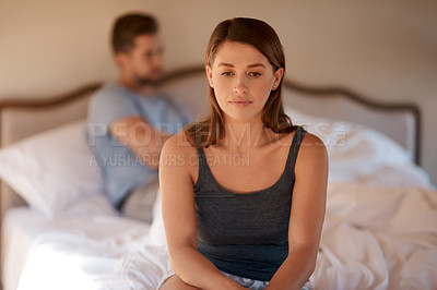 Buy stock photo Sad, upset and couple in an argument in their bedroom for divorce or breakup in a modern house. Toxic, mad and face of a woman fighting and in conflict with her boyfriend in bed in their home.