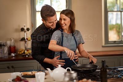 Buy stock photo Happy, love and couple in kitchen for cooking, brunch or bonding with funny, conversation or hug at home. Food, diet and nutrition in house for breakfast, balance and meal prep with support or chat