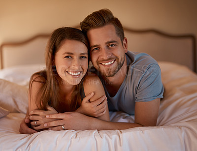 Buy stock photo Portrait, smile and love of couple in bed at home together for bonding, embrace and relax. Face, happy man and woman in bedroom for healthy relationship, night and connection for care in apartment