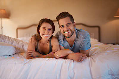 Buy stock photo Portrait, love and happy couple in bed in home together for bonding, laughing or relax. Night, man and smile of woman in bedroom for healthy relationship, support and connection for care in apartment