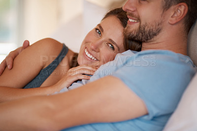 Buy stock photo Love, happy and portrait of couple on bed for bonding, loving relationship and relaxing together in home. Marriage, morning and man and woman in bedroom with smile, embrace and cuddle on weekend