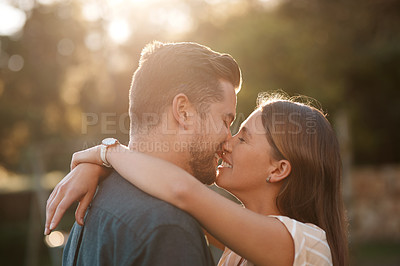 Buy stock photo Shot of an affectionate couple spending the day outdoors