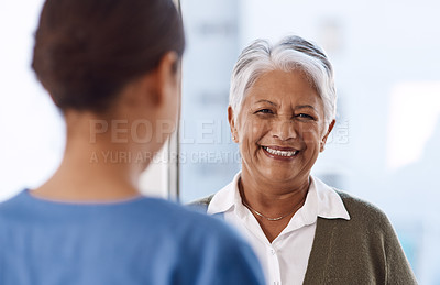 Buy stock photo Healthcare, happy or nurse talking to an old woman about treatment in a nursing home facility clinic. Elderly face, smile or female medical worker speaking to a senior patient in a hospital visit 