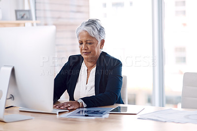 Buy stock photo Focus, computer and search with a business woman or CEO working in her corporate office. Serious, professional and leadership with a senior female manager at work typing an email or proposal
