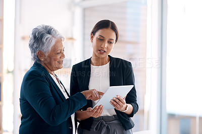 Buy stock photo Collaboration, mentor and business women with tablet for talking, cooperation or planning. Technology, teamwork and happy senior manager with female analyst for intern training or coaching in office