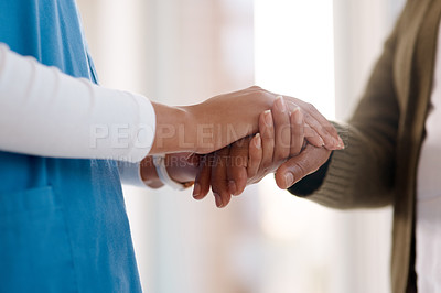 Buy stock photo Woman, holding hands or consulting a caregiver for support or empathy for healthcare service of cancer therapy. Closeup, psychology clinic or sick patient in counseling with a nurse in consultation 