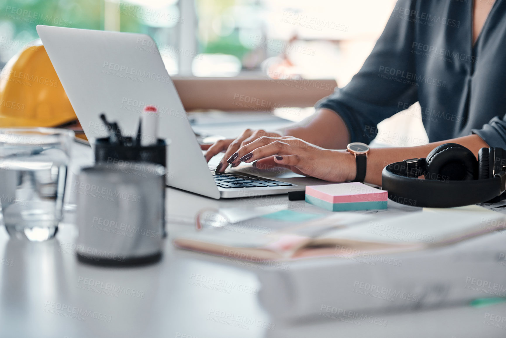 Buy stock photo Architecture, typing and hands of woman on laptop for research, review or online report in building development. Computer, networking and architect writing email, feedback and planning with blueprint