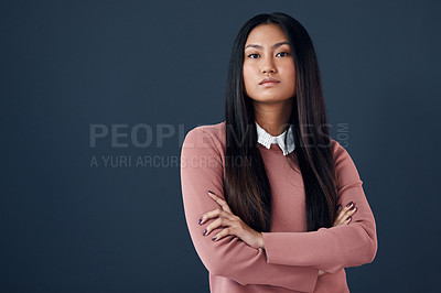 Buy stock photo Confident, portrait of Korean woman and in a studio background with her arms crossed. Empowerment or elegant, corporate worker and pose with serious or proud young businesswoman in a backdrop.