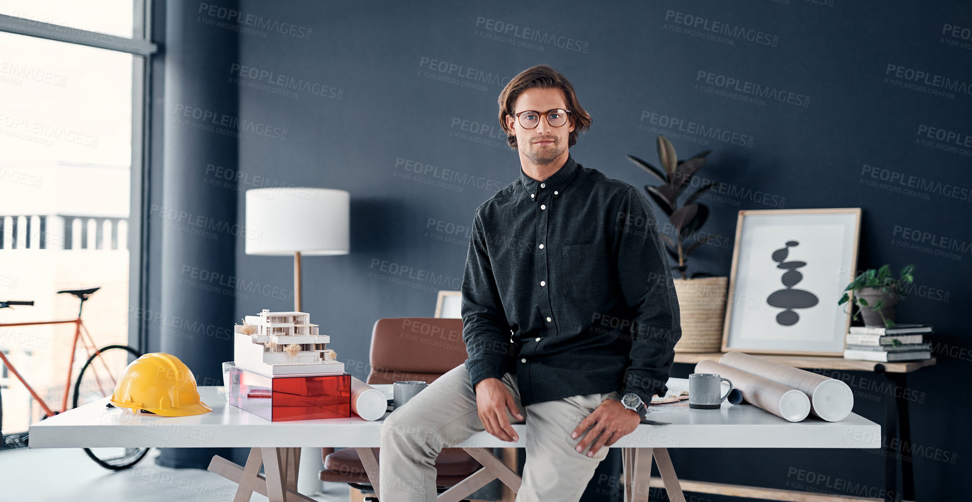 Buy stock photo Man, architect and serious in portrait at desk in office, professional contractor and pride in career. Civil engineering, architecture and employee, confident and creative with property development