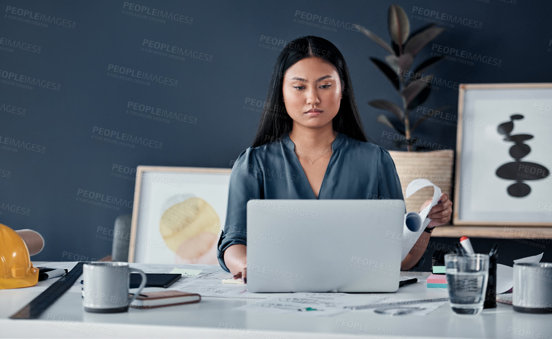 Buy stock photo Architecture, laptop and business Asian woman in office with design, floorplan and blueprint for building. Creative, engineer and person on computer for planning, research and construction project