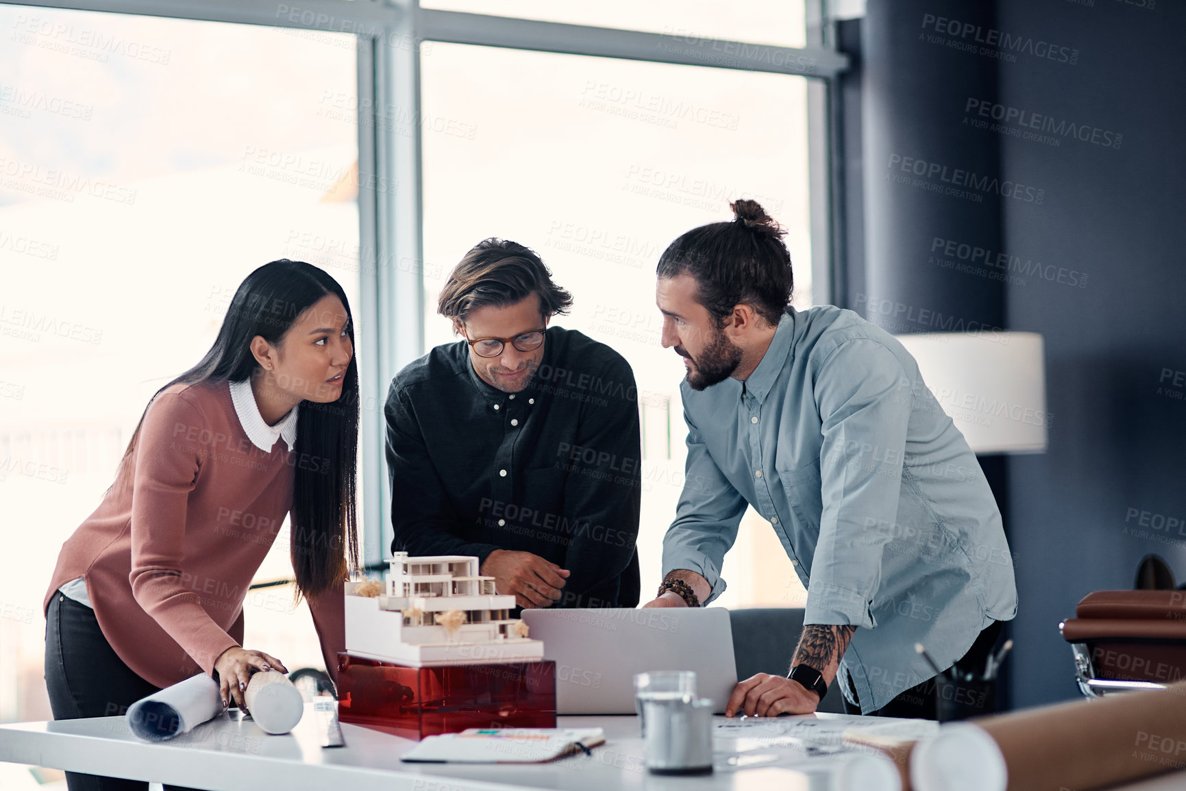 Buy stock photo Architect, team and meeting with laptop for discussion, design or planning for construction at office. Group of creative employees or civil engineers brainstorming on computer for building or startup