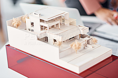 Buy stock photo Architecture, closeup and model of modern house on desk with people, planning and vision for real estate. Design, engineering and development for property agency, expansion and presentation at office