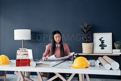 Buy stock photo Architect, woman and reading of plan in office for building layout, blueprint and remodeling project. Engineering, professional employee and paperwork for real estate development and home renovation