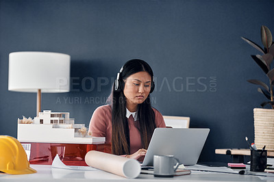 Buy stock photo Architect, woman and headphones with laptop in office for construction project, thinking and music for inspiration. Person, property developer and audio streaming with idea, vision or job in Jakarta